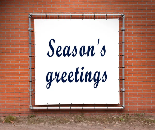 Large message written on a wall - Season's greetings — Stock Photo, Image