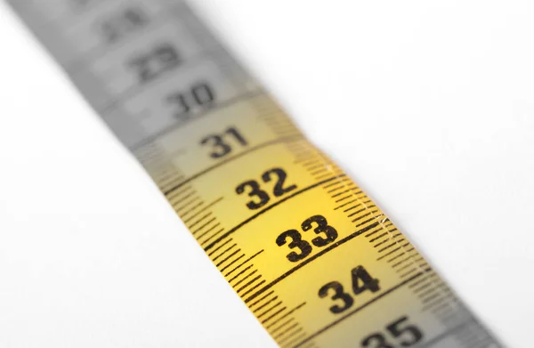 Measuring tape, selective focus on 33 — Stock Photo, Image