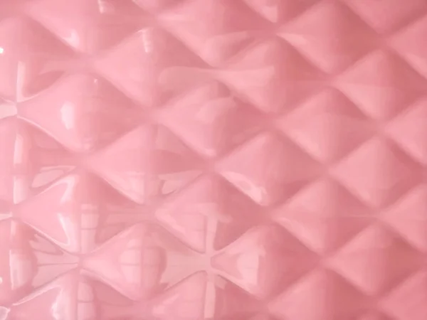 Closeup and crop bathroom pink tiles pattern background and wallpaper.