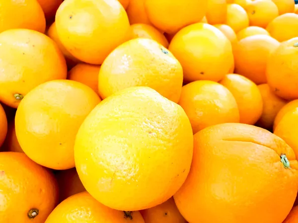 Closeup and crop heap of Chinese oranges fit on screen background and wallpaper.