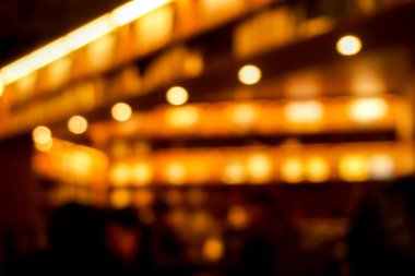 Closeup restoran tavan ve bokeh refection aydınlatma sarı sıcak ışıklar ile bulanık.