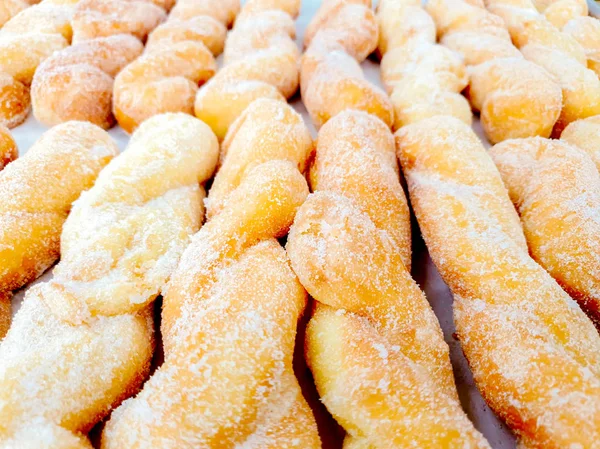 Closeup Crop Lots Twist Doughnut Sugar Shelf Bakery Shop Background — Stock Photo, Image