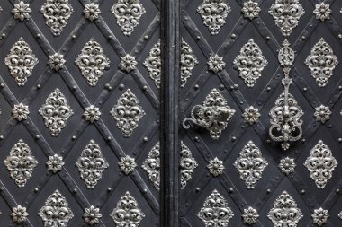 Historic ironwork at a door in Prague clipart