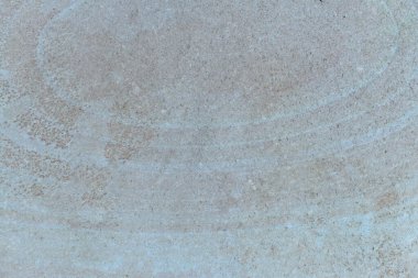 Sahildeki taşın dokusu ve arkaplanı için yakınlaşması