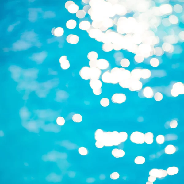Soft Fokus Bokeh Lichteffekte Über Einem Welligen Blauen Wasserhintergrund Pool — Stockfoto