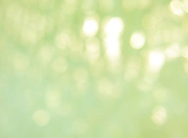 Dalgalı, soyut bir arka plan üzerine yumuşak odak ışığı efektleri