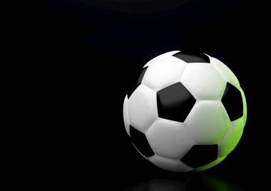 Bir futbol topu yatay yönde siyah arka plan