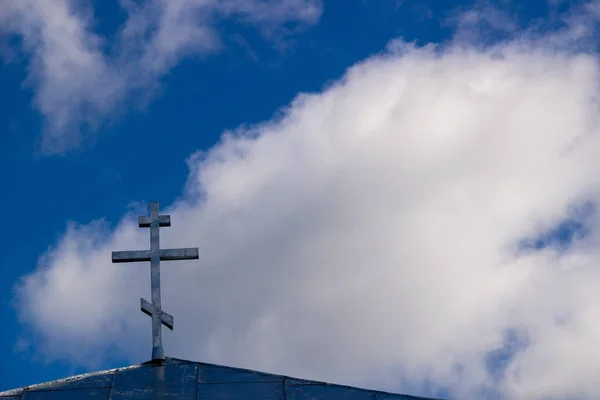 Orthodox Christianity. Jesus. Easter. a gold dome with a cross against the sky. Orthodox cross in the blue sky. Christianity. Religion.