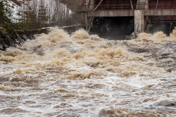 Stormy mountain river with large waves