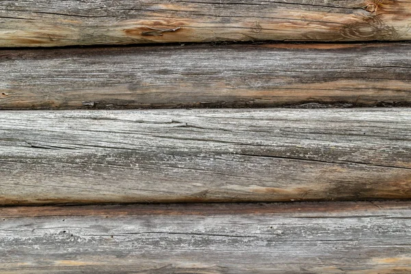 Magnífico fondo de una antigua pared texturizada hecha de vigas de madera marrón — Foto de Stock