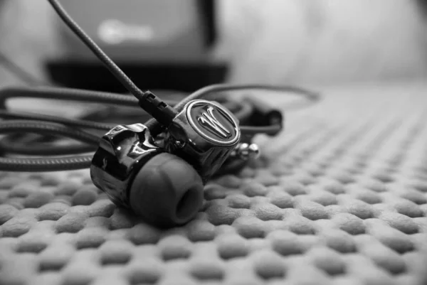 Black and white frames of headphones sound devices macro photography — Stock Photo, Image