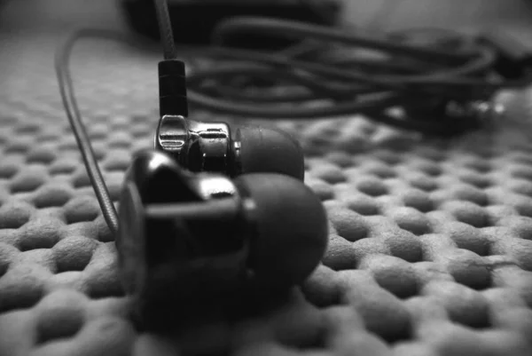 Black and white frames of headphones sound devices macro photography — Stock Photo, Image
