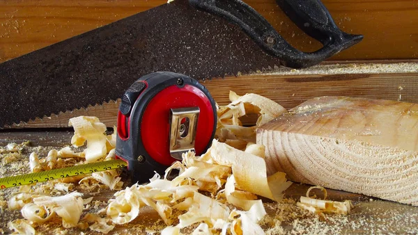 Working with wood.Carpenter\'s tools,shavings.