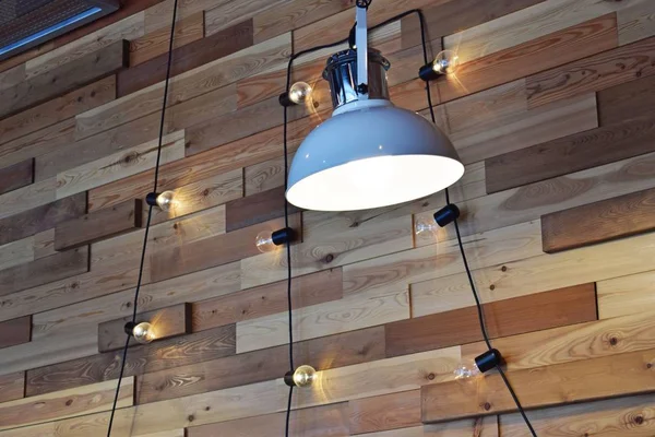 Wall design in the cafe.Lamps and bulbs on the cord.