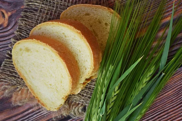 Fresh Bread Wicker Basket Green Ears Wooden Background — Stock Photo, Image