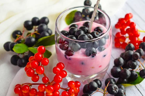 Ripe,fresh berries.Delicious dessert in a glass Cup on the table.