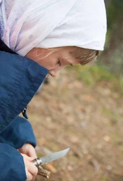 Little Girl Carefully Carving Wooden Toy Outdoors — Stock Photo, Image