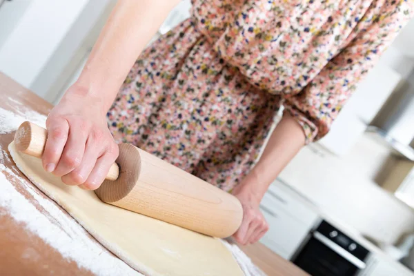 Young beautiful girl making dough — Stock Photo, Image
