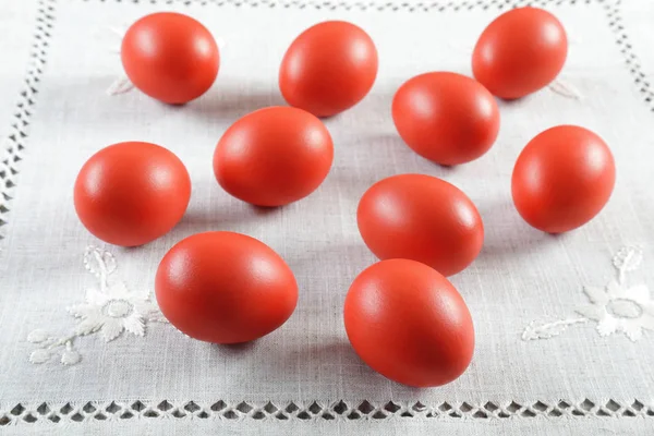 Colourful Easter eggs on ornated linen cloth — Stock Photo, Image