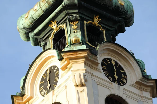 View of the Stiftskirsche tower with the clock — Stock Photo, Image