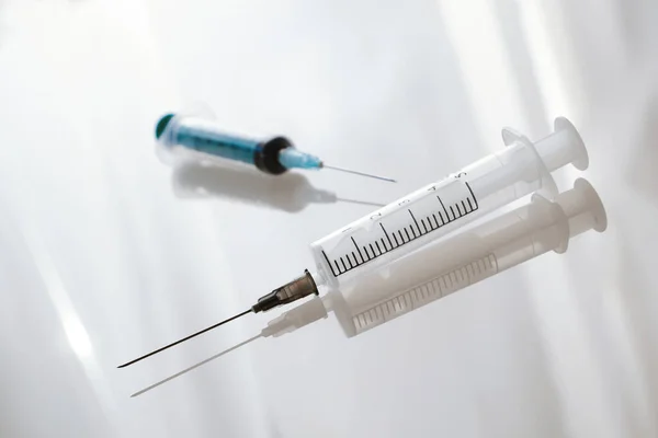 Medical syringe on the white background — Stock Photo, Image