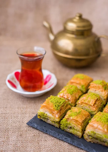 Turkish sweet baklava on plate with Turkish tea.