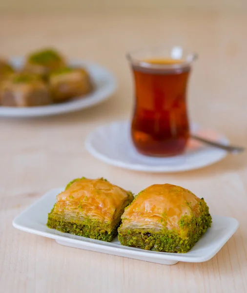 Turkish sweet baklava on plate with Turkish tea.