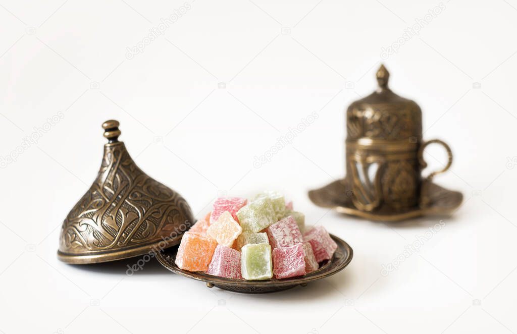Turkish coffee with Turkish Delight on white background.
