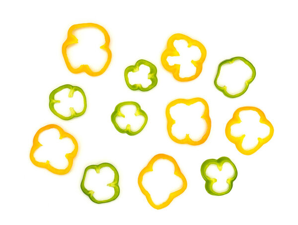 Colorful slices of bell pepper isolated on white background.