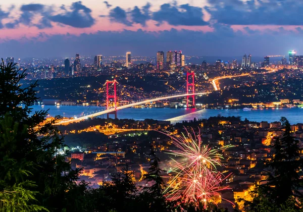 Istanbul Bosphorus Bridge with Fireworks. 15th July Martyrs Bridge. Night view from Camlica Hill. Istanbul, Turkey.