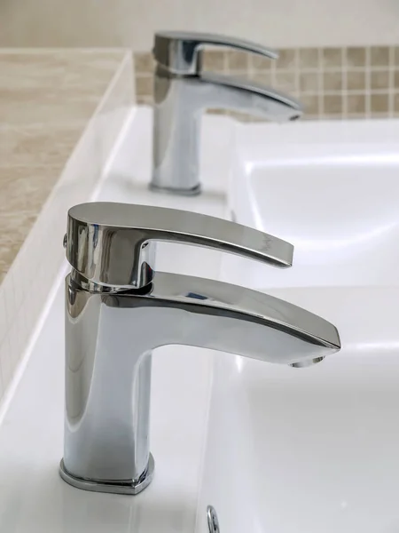 Two Bathroom Chrome Faucets Double White Ceramic Washbasin — Stock Photo, Image