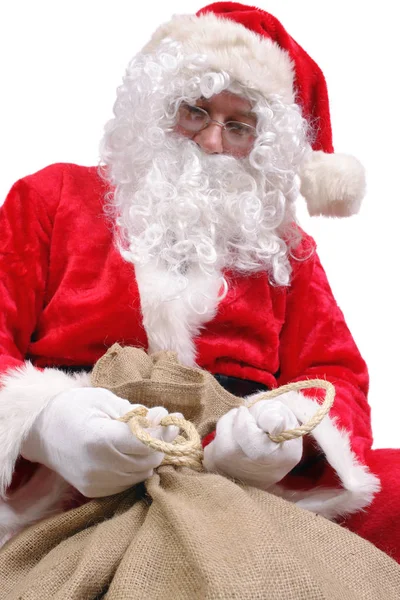 Père Noël attacher sac avec des cadeaux — Photo