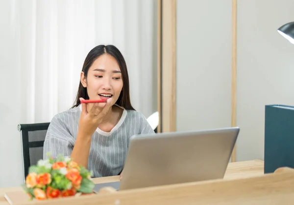 Beautiful young asian woman using video conference and call to people,Work from home,Work at home