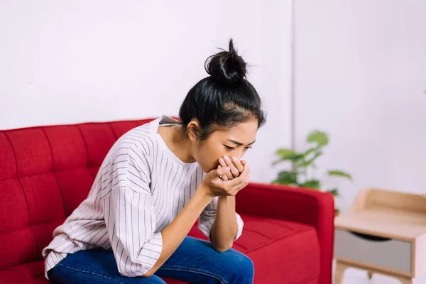 Asian woman coughing with sore throat,Women suffering with cough a lot at home