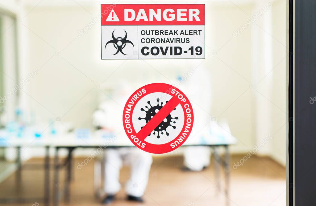 Coronavirus warning sign alert danger on window at quarantine room,Covid 19 disease