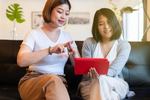 Couple asian woman communicating via sign hands language on video call to a deaf person