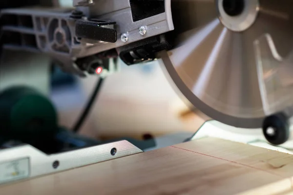 Modern electric circular saw in the workshop — Stock Photo, Image