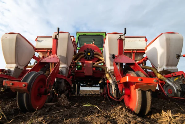 Farmer with tractor seeding soy crops at agricultural field — Stock Photo, Image