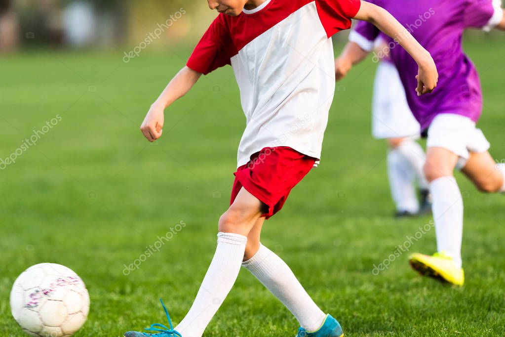 Young boys playing soccer.