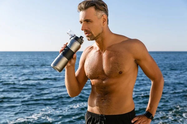 Shirtless Handsome Adult Sportsman Fitness Bottle Looking Away Seashore — Stock Photo, Image