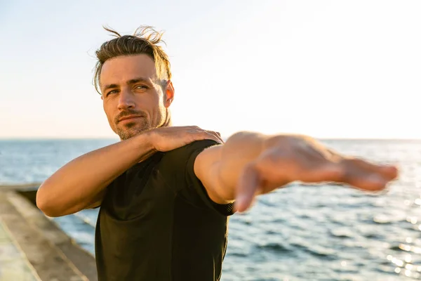 Adult Sportsman Stretching Arm Training Seashore — Stock Photo, Image