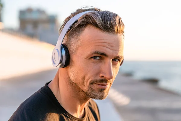 Close Portrait Handsome Adult Man Wireless Headphones Looking Camera Seashore — Stock Photo, Image