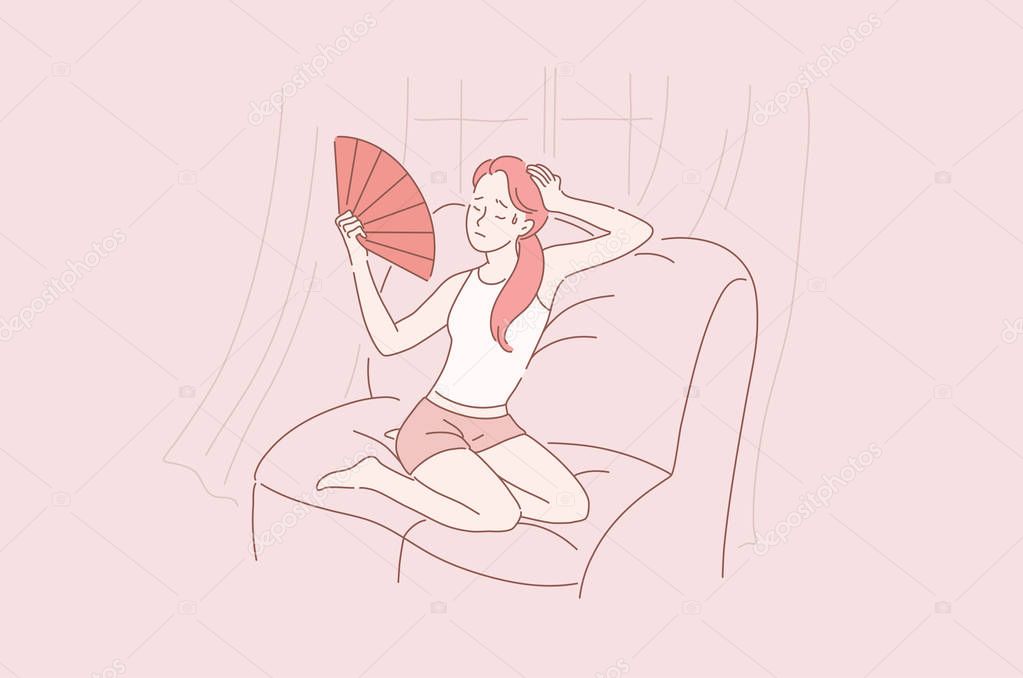 Young beautiful, sweet girl or woman with closed eyes sitting on the couch at home very hot, stuffy, uncomfortable. The air conditioning s broken.