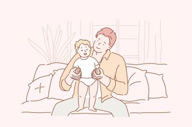 Aile, babalık, aşk kavramı. Genç ve mutlu bir adam çocuğunu tutuyor. F evde küçük kızı veya oğlu ile ather. Babalar günü