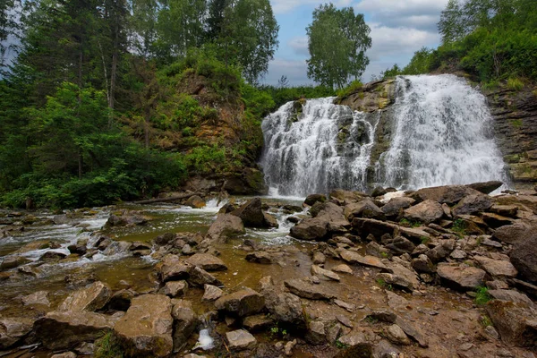 Russia. Altai territory. Waterfall on the river Pescherka