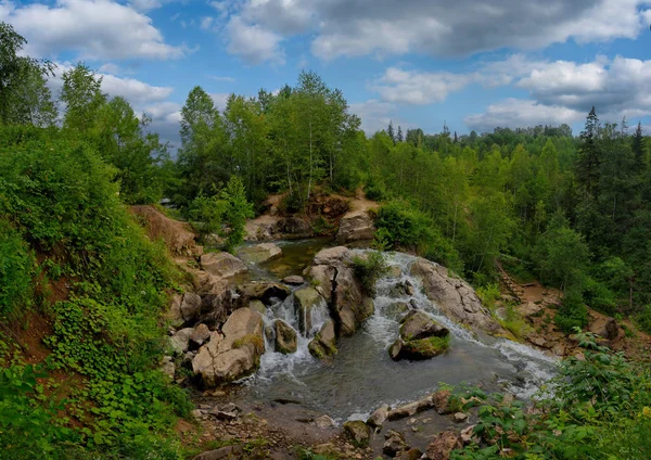 Russia. Altai territory. Waterfall on the river Pescherka