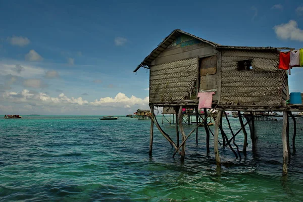 East Malaysia. A village of sea Gypsies in the middle of the ocean engaged in fishing.