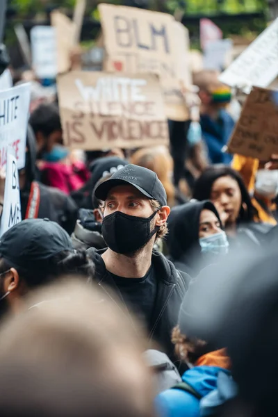 stock image London / UK - 06/06/2020: Black Lives Matter protest during lockdown coronavirus pandemic. Thousands of protesters marching with signs, banners at Westminster square, Houses of Parliament