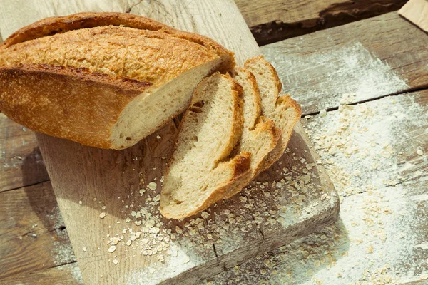 Sliced gluten free bread on wooden table. — Stock Photo, Image