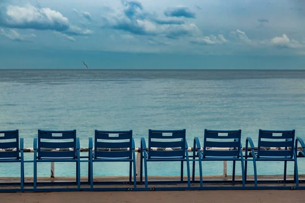 Empty chairs on a coastline of Nice. Isolation time in Europe. Favorite place on Cort de Azur. — Stock Photo, Image